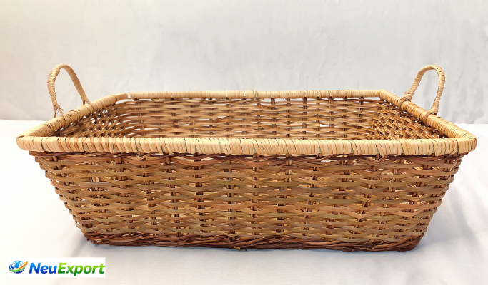 Top-down view of a handwoven natural rattan tray showing detailed cross-grid craftsmanship