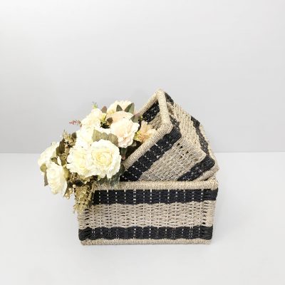 Eco-friendly striped seagrass basket styled with decorative floral arrangements