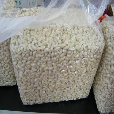 Bulk packaging of large white whole W180 cashew nuts for B2B wholesale export.