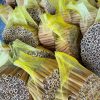 Wholesale Premium Tube Cassia Vietnam securely packed in yellow mesh bags, ready to be loaded into export cartons for Middle Eastern and Indian buyers.