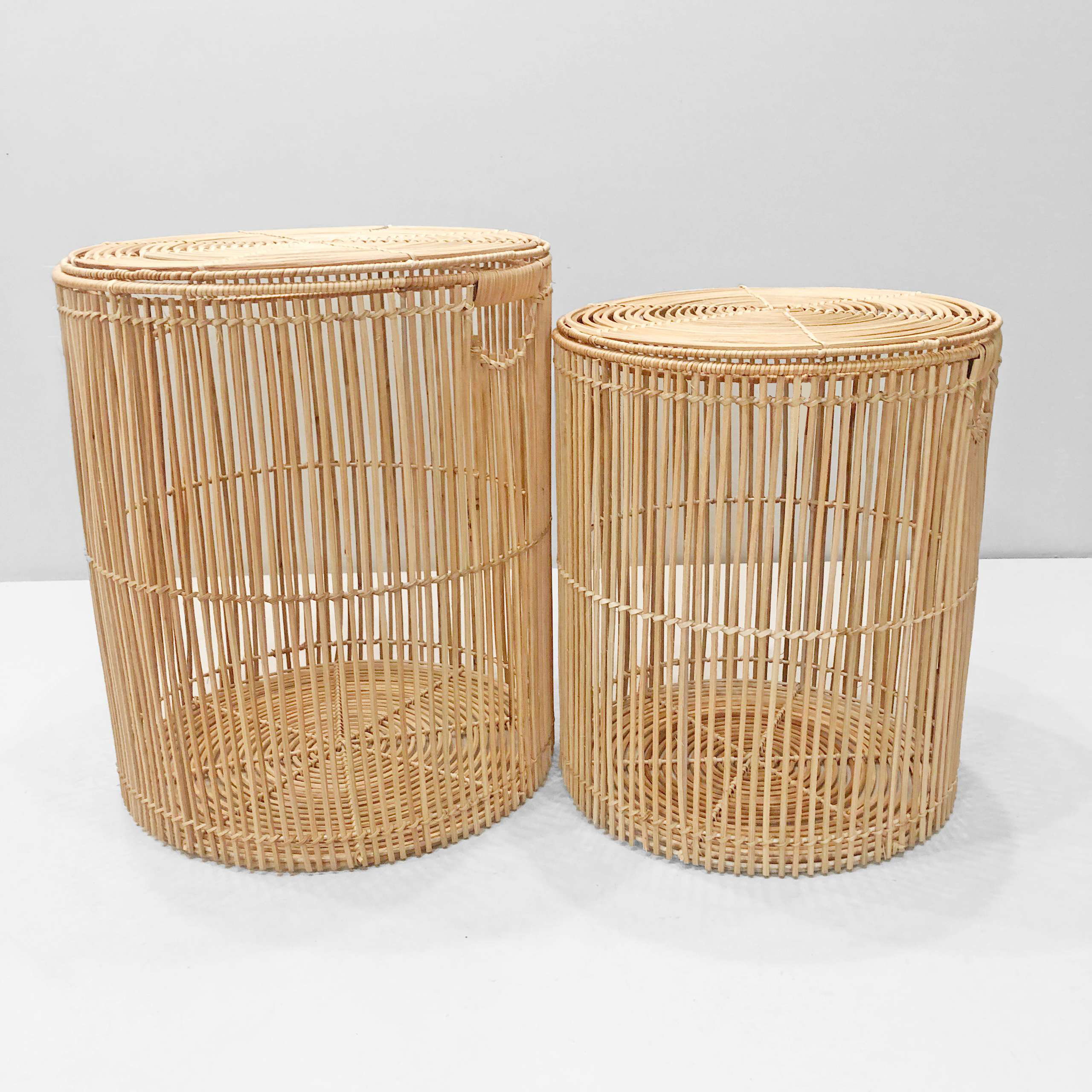Premium handwoven cylindrical natural rattan storage baskets.
