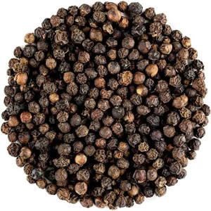 A perfect circular mound of premium Organic Black Peppercorns.
